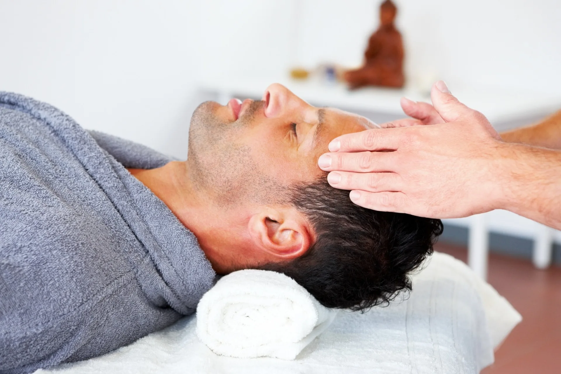 man at spa getting energy healing